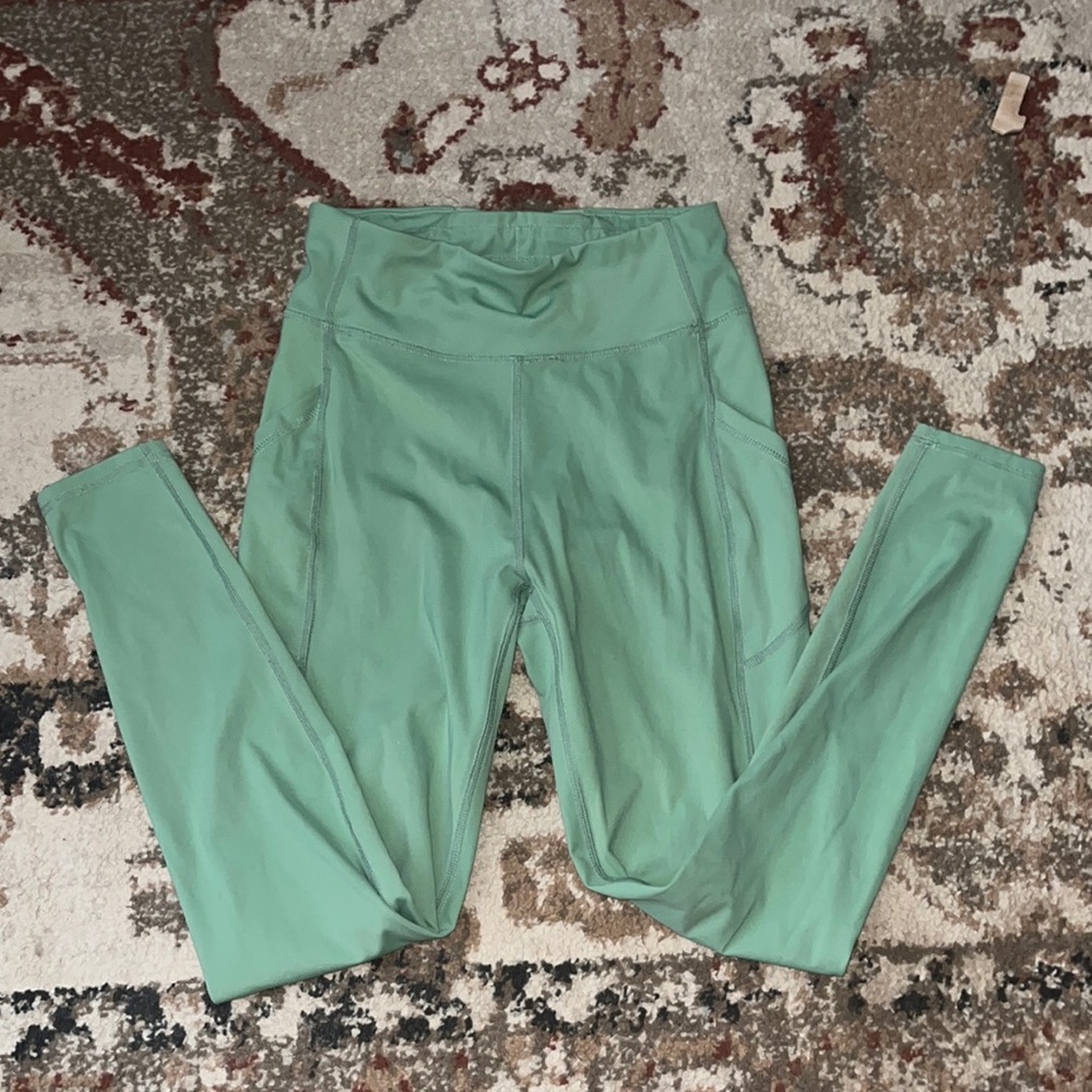 Green tights with side pockets